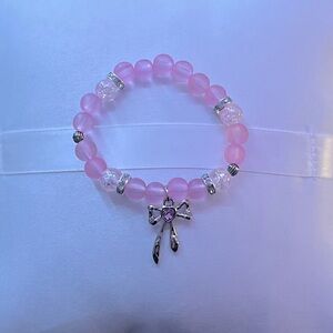 Pink bracelet with charm